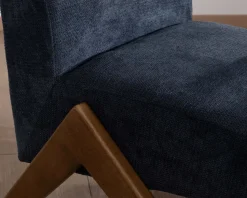 Meuble House Fauteuil rétro tissu bleu foncé avec pieds bois boomerang "Tolga"