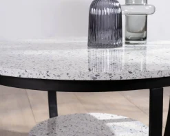 Meuble House Table basse ronde en terrazzo blanc et métal noir 
