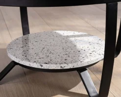 Meuble House Table basse ronde en terrazzo blanc et métal noir 